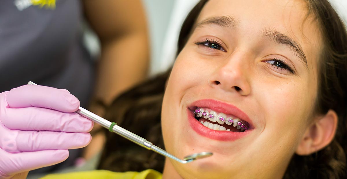 Kid with braces seeing orthodontist